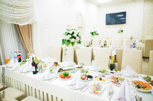 Interior of a restaurant prepared for wedding ceremony © olegparylyak