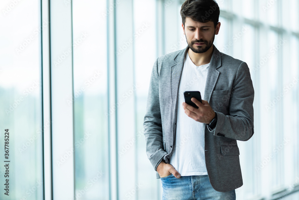 happy young business man work in modern office happy young business man work in modern office