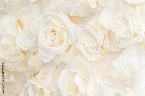 Artificial white rose buds for background and design. White floral background