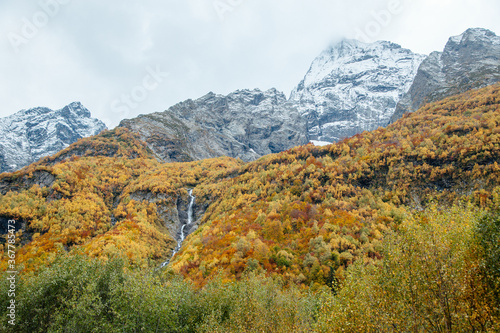 Beautiful colorful landscape in the mountains of Dombay ski resort in autumn season, trekking and hiking in the mountains.