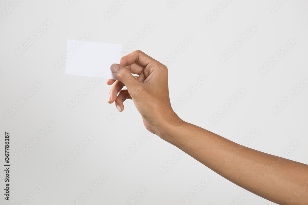 Male hand holding business card. Male hand holding business card.