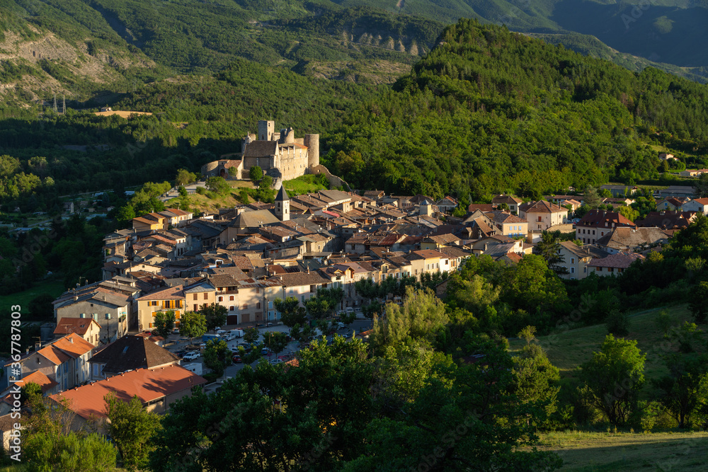 The village of Tallard and its medieval castle at sunset in the Durance Valley, Hautes-Alpes (05), Alps, France
