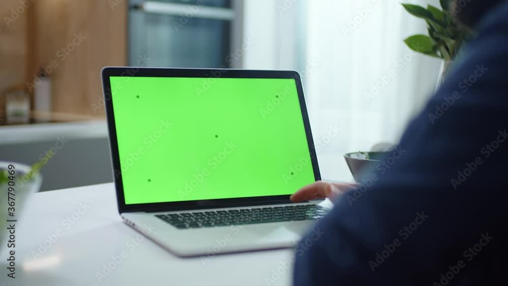 Man Works With a New Modern Elegant Laptop. Green Screen VFX. Man Works With a New Modern Elegant Laptop. Green Screen VFX.