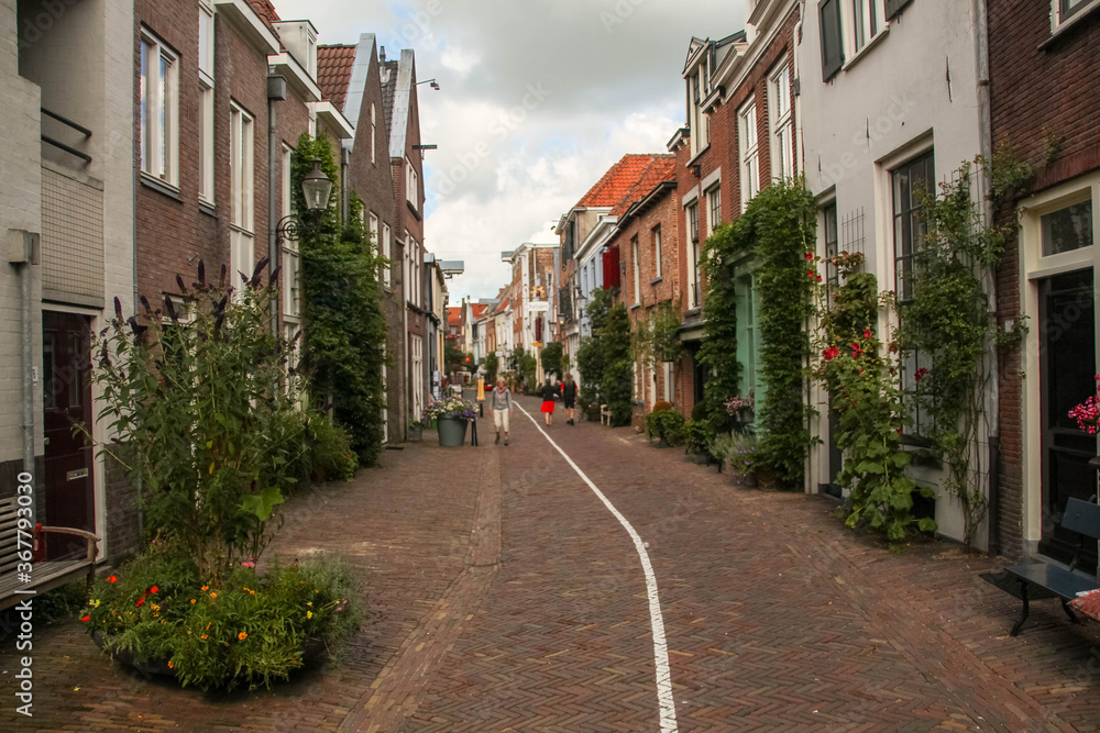 Deventer, Netherlands - July 11 2020: Famous Walstraat in the Dutch historic city center of Deventer
