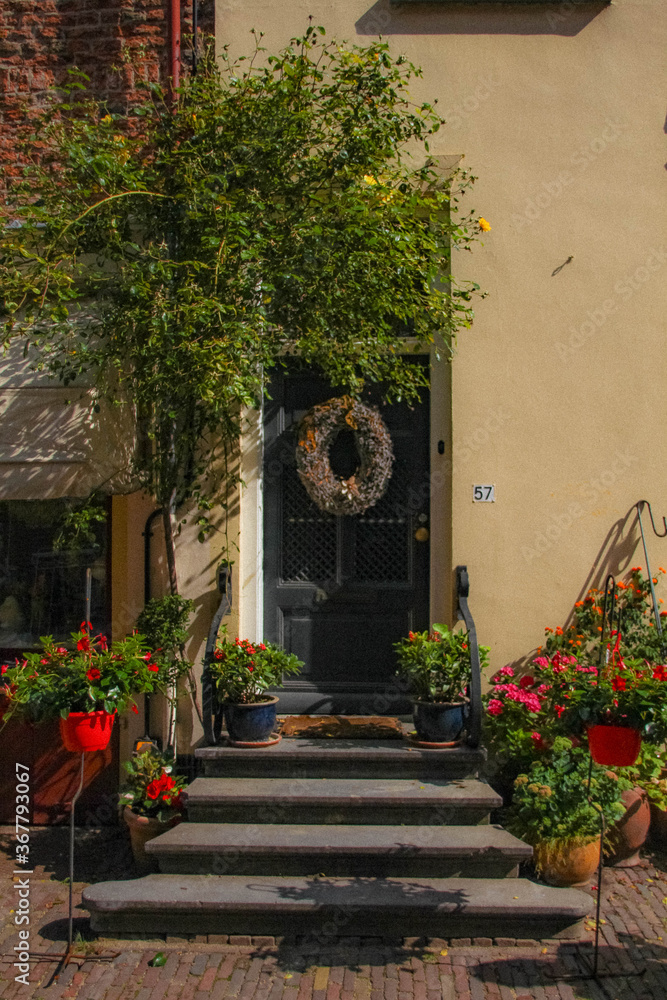 Naklejka premium Deventer, Netherlands - July 11 2020: Famous Walstraat in the Dutch historic city center of Deventer