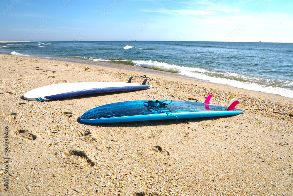 Two surfboards on the beach. Two surfboards on the beach.