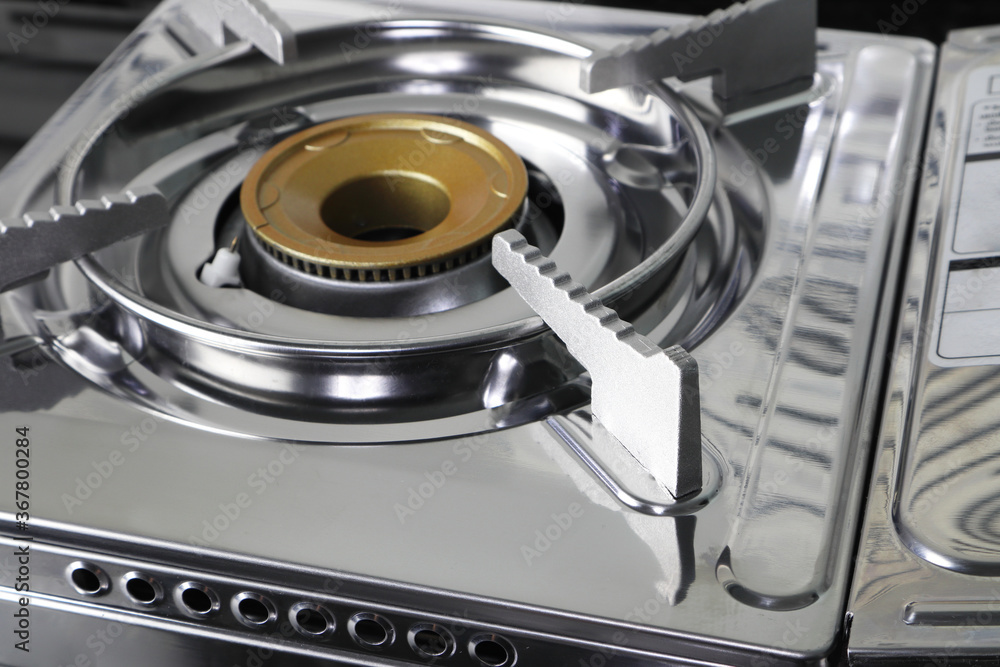 The stainless steel gas cooker stove isolated on white The stainless steel gas cooker stove isolated on white