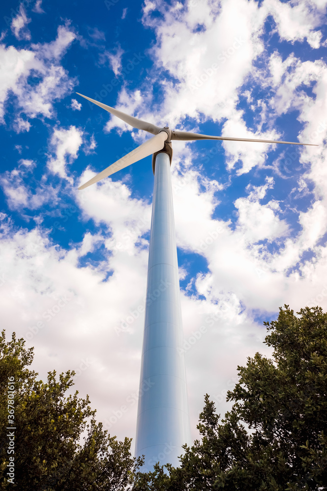 Wind turbines viewed from below help decontaminate the air. Wind turbines viewed from below help decontaminate the air.