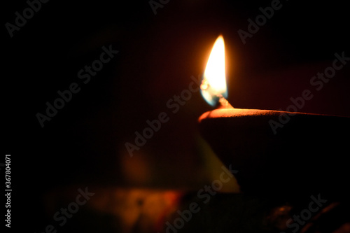 Beautiful traditional lamps lit up in a line on the occassion of Diwali festival in India