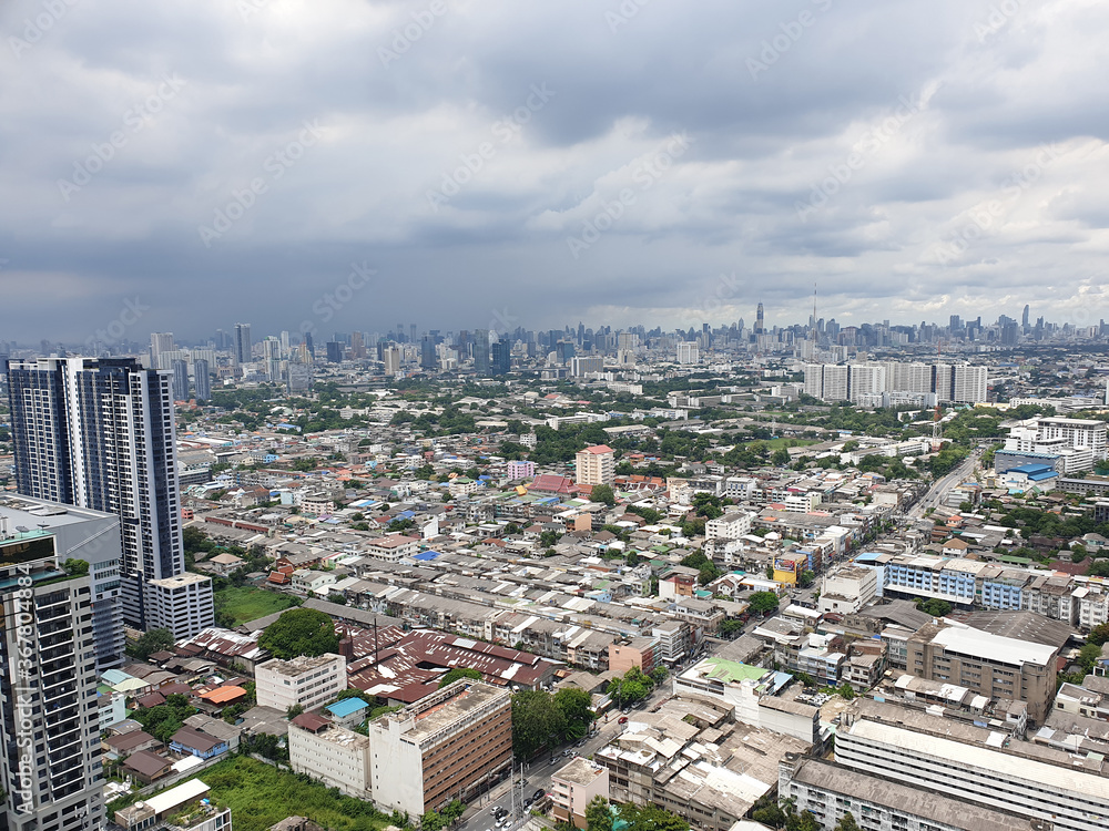 Fototapeta premium Top view city scape high building, center town . Cloudy sky Like it was raining Bangkok Thailand.