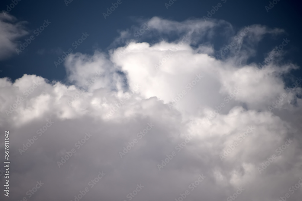 Cumulus clouds look like fluffy, white cotton balls in the sky..Monsoon rain clouds forming Cumulus clouds look like fluffy, white cotton balls in the sky..Monsoon rain clouds forming