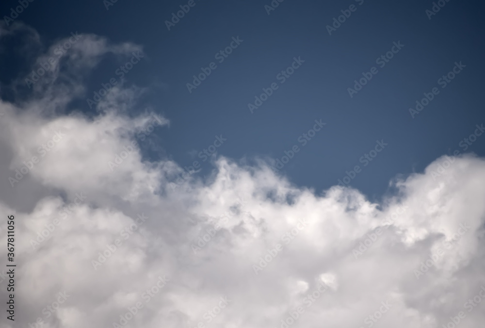 Obraz premium Cumulus clouds look like fluffy, white cotton balls in the sky.