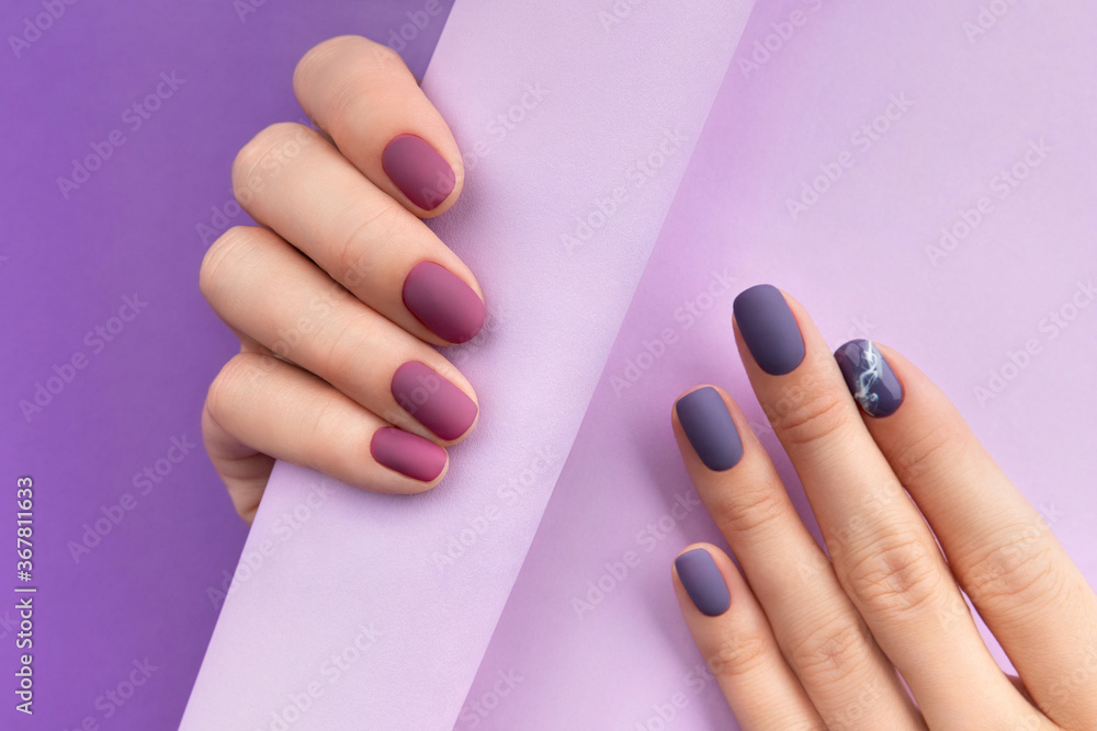 Beautiful purple burgundy matte manicure on creative background - obrazy, fototapety, plakaty 