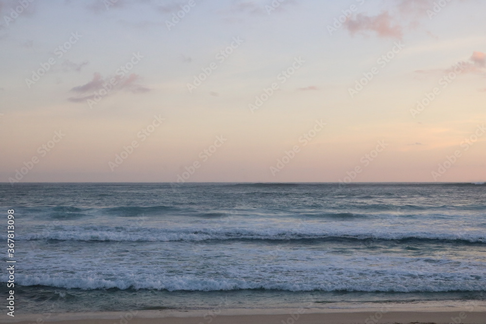 The oceans waves sand and sunset - Mekaki bay Lombok