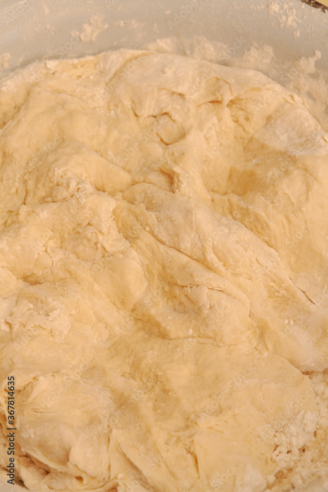 Raw dough mixed in a bowl for making homemade dumplings Raw dough mixed in a bowl for making homemade dumplings
