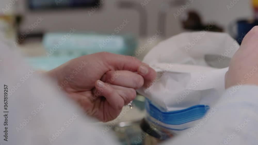 Close up of busy hands Woman Measures out a cup of flower for baking recipe Close up of busy hands Woman Measures out a cup of flower for baking recipe