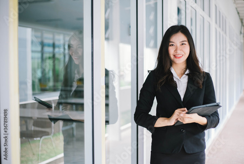 Beautiful young asian woman holding tablet pc Free Download Beautiful young asian woman holding tablet pc - GFXLoad