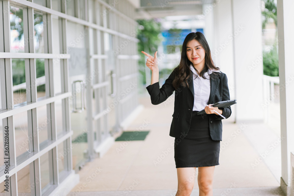 Beautiful young asian woman holding tablet pc Beautiful young asian woman holding tablet pc