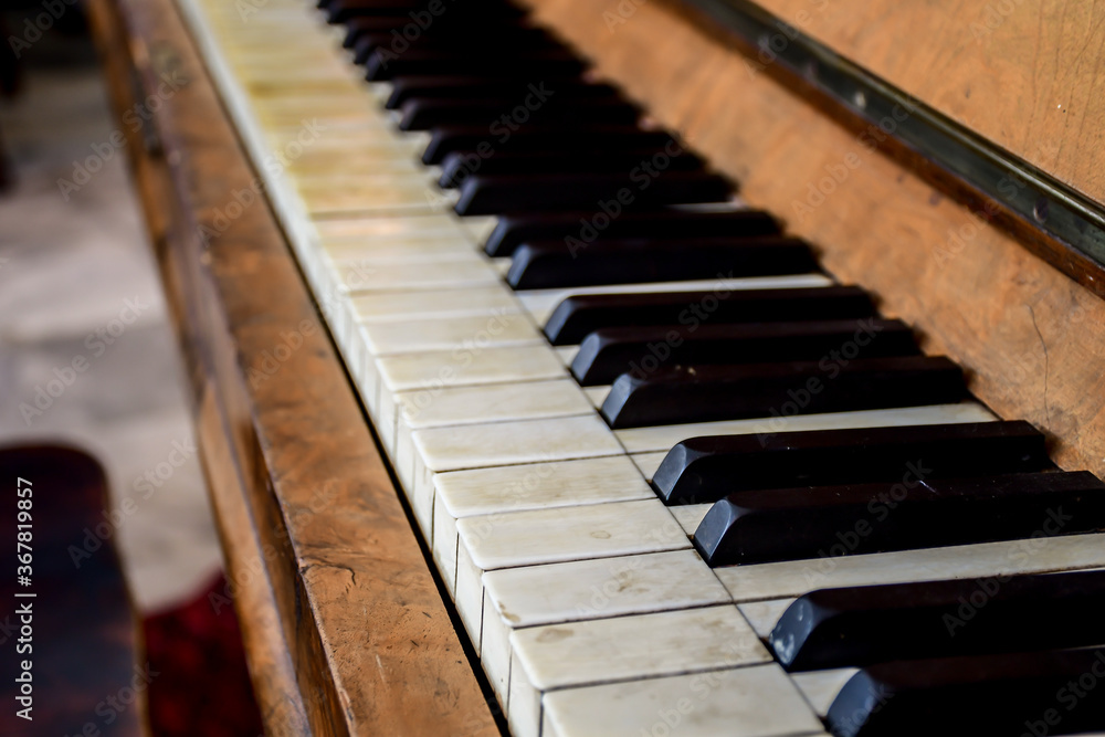 Close up wooden old piano with piano key. Selective focus