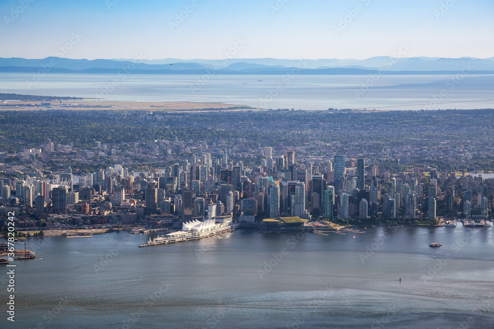Obraz premium Downtown Vancouver, British Columbia, Canada. Aerial View of Coal Harbour and Modern Urban City during a Sunny Day.