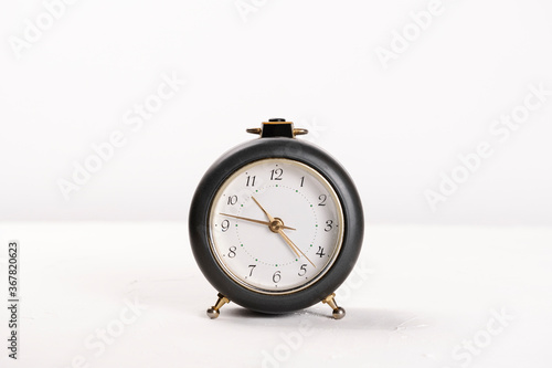 grey alarm clock, on a white background