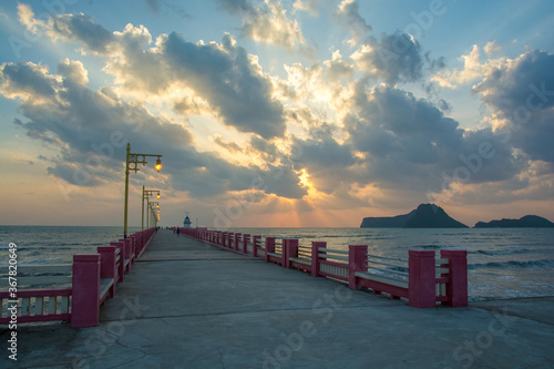 Beautiful blazing sunrises landscape with cloud and sun rays at Ao Prachuap bay with Saranwithi bridge stretching in to the sea Prachuap khiri khan province, Thailand.Public domain photo