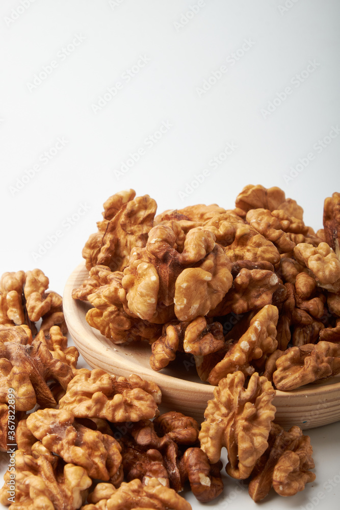Walnut kernels on a wooden background. Walnut kernels on a wooden background.