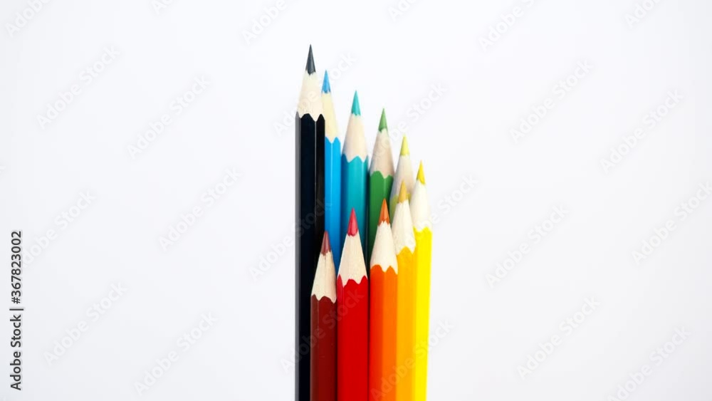 Colored wooden pens with a white background make a twist Colored wooden pens with a white background make a twist