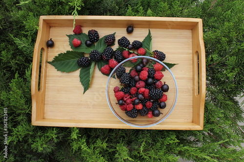raspberries and blackberries in a bowl