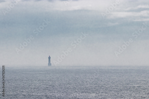 Jument lighthouse, off the island of Ouessant photo