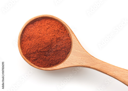 Fotografija Top view of of red paprika powder in wooden spoon