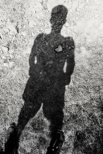 Stone heart in the shadow of a man
