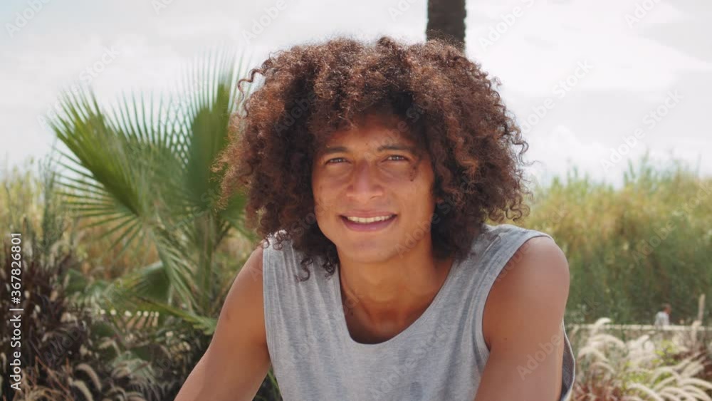 Hispanic latin young man holding skateboard and smiling, portrait of happy skater in skatepark spain, barcelona, brazilian male professional skateboarder Hispanic latin young man holding skateboard and smiling, portrait of happy skater in skatepark spain, barcelona, brazilian male professional skateboarder