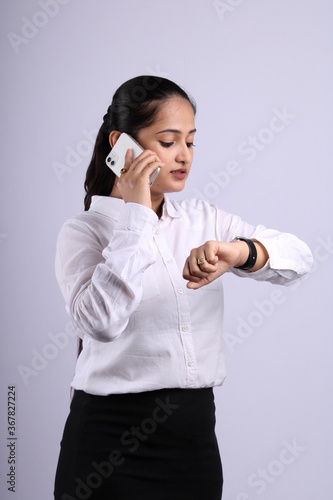 Indian business woman speaking on mobile phoe photo