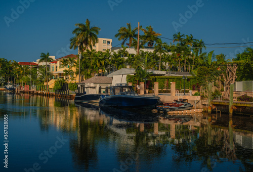 tropical resort in the morning miami florida boat reflection palms sea 