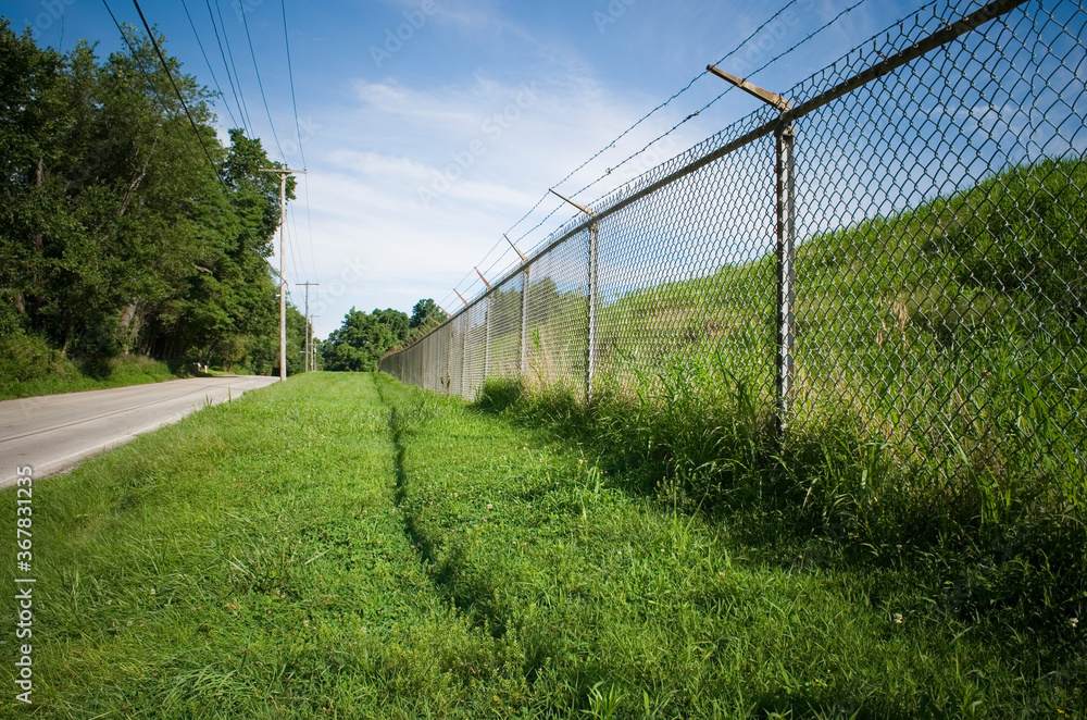 prison fence on country road