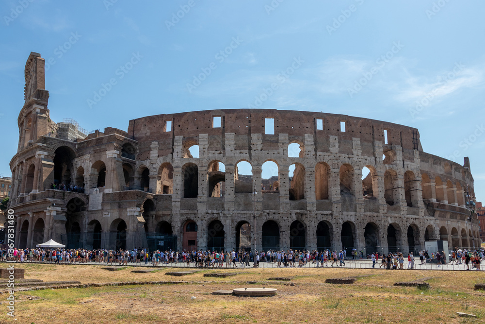 roman colosseum surrounded by tourists