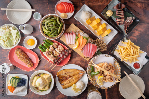 traditional japanese izakaya style foods on wooden table