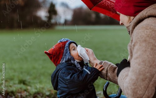 Photography Mother wiping daughter’s nose