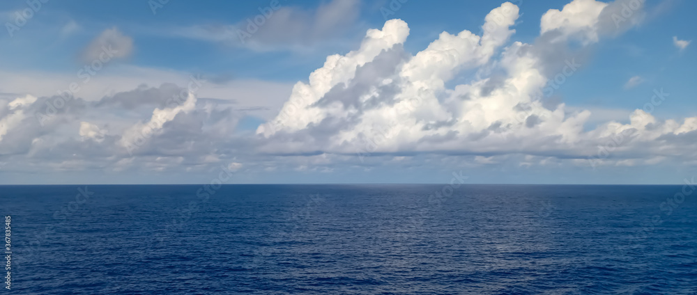 Beautiful blue ocea white clouds and horizon Beautiful blue ocea white clouds and horizon