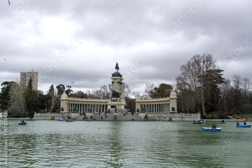 Artifical lake and monument to Alfonso XII in the Buen Retiro Park, one of the main attractions of Madrid, Spain.