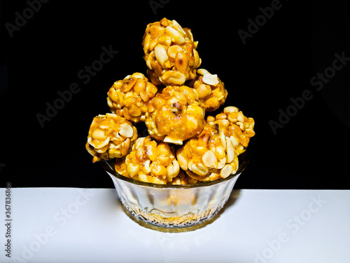Canvas Print Sweet Peanut balls or laddu made with roasted peanut and jaggery ,served in glas