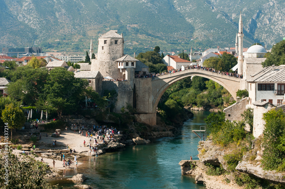 Mostar bridge with mountains in background, Bosnia and Herzegovina