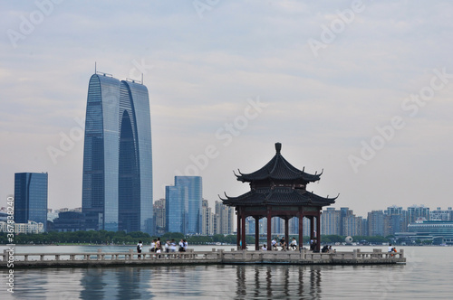 View on Shuzhou business centre with pagoda and lake in foreground.