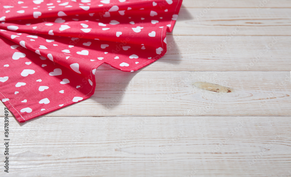 Obraz premium Red napkin. Stack of colorful dish towels on white desk