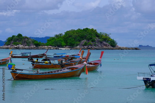 Some typical boats waiting around the island of Ko Lipe to go for their daily business. © Marco