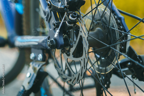 Close up of brakes of the blue sport bisycle.