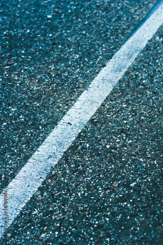 Marked asphalt road iclose up. Blue tonning photo