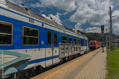 Payerbach-Reichenau station with electric blue old passenger unit in summer day