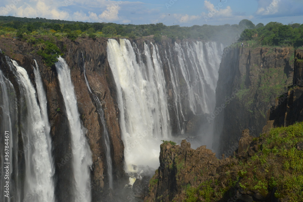 Naklejka premium The massive Victoria Falls waterfalls between Zimbabwe and Zambia in Southern Africa